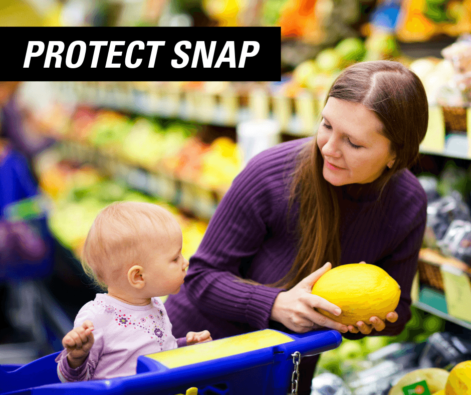 Woman holds fruit and shows it to her baby in a blue shopping cart under the words "PROTECT SNAP"