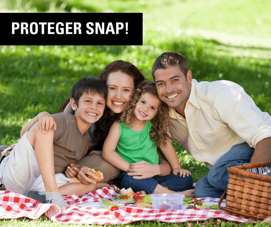 Family of four smiles and hugs at a picnic under the words "PROTECT SNAP"